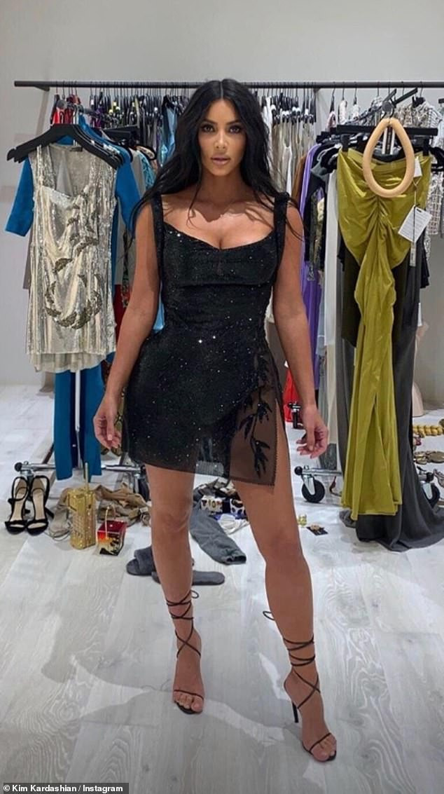 Kim Kardashian showcases her curves in sheer vintage Versace mini dress for Kourtney