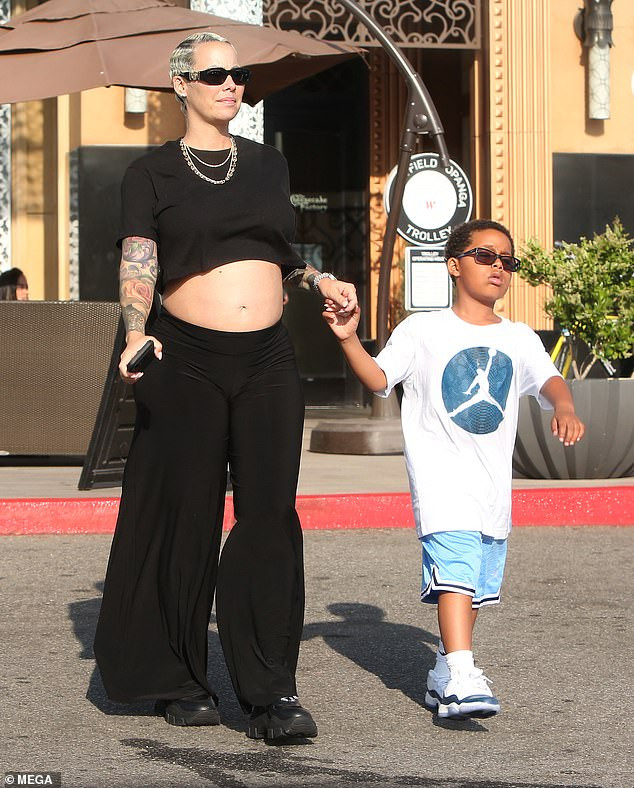 Amber Rose flaunts her blooming baby bump as she enjoys lunch date with her son Sebastian and beau Alexander Edwards (Photos)