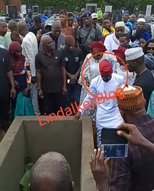 Adekunle Gold and wife Simi filmed paying their last respects as his father, Prince Hakeem Kosoko is laid to rest (photos/videos)