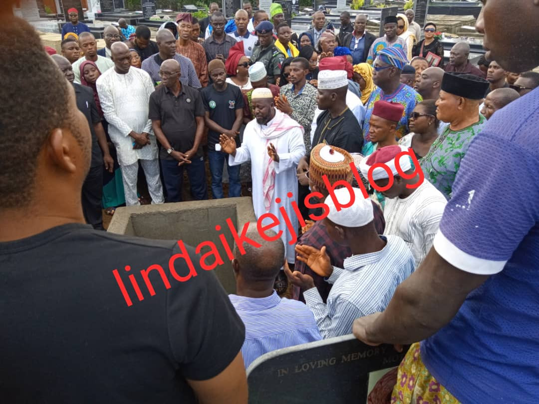 Adekunle Gold and wife Simi filmed paying their last respects as his father, Prince Hakeem Kosoko is laid to rest (photos/videos)
