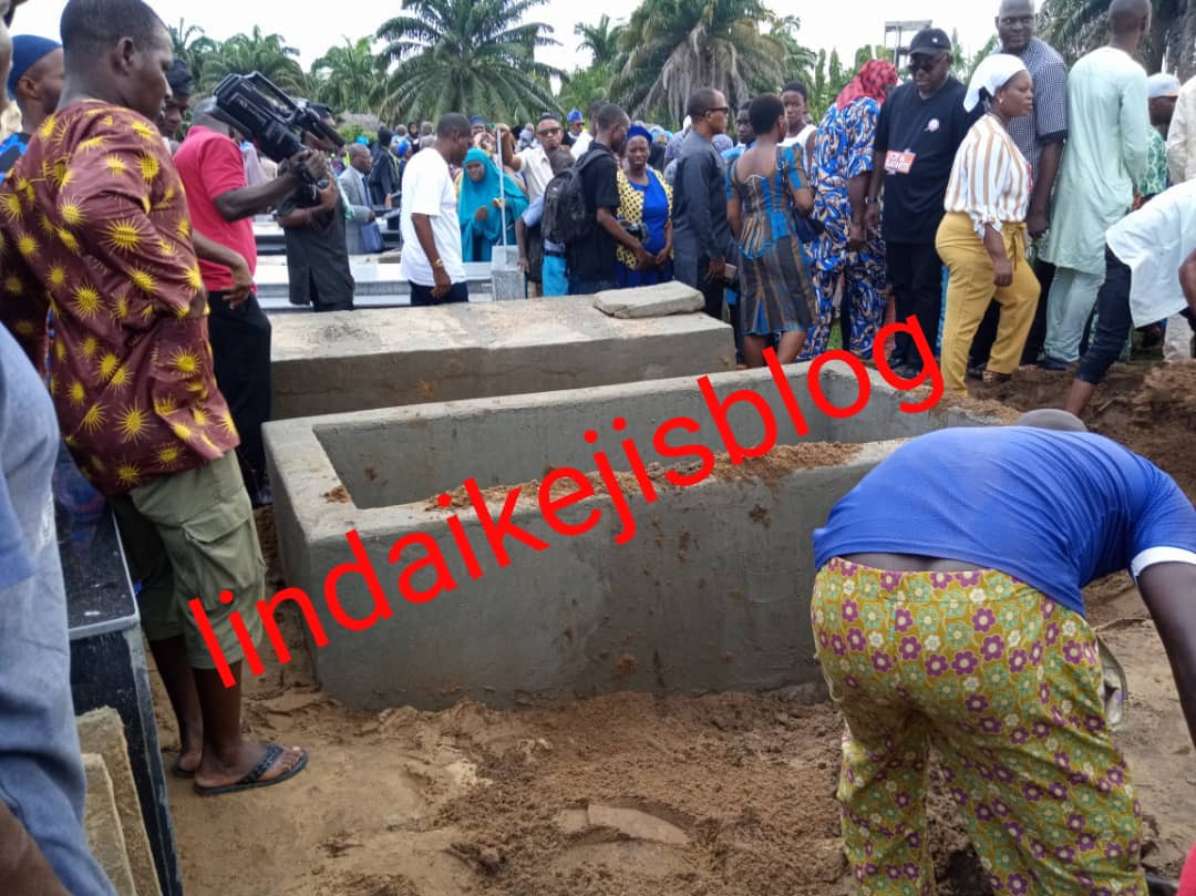 Adekunle Gold and wife Simi filmed paying their last respects as his father, Prince Hakeem Kosoko is laid to rest (photos/videos)