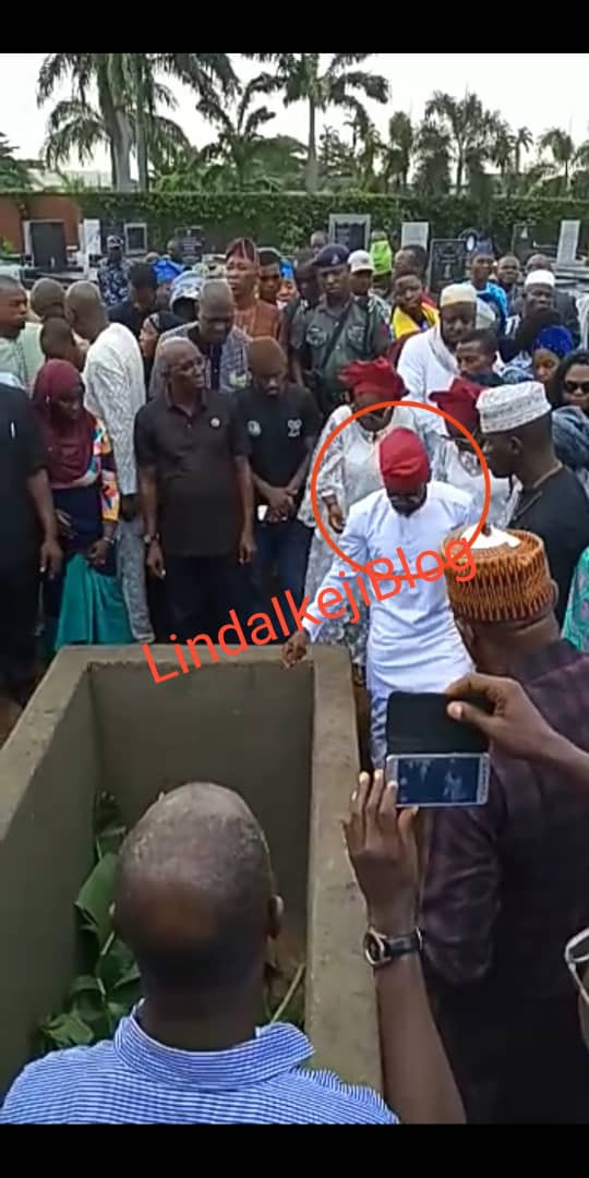 Adekunle Gold and wife Simi filmed paying their last respects as his father, Prince Hakeem Kosoko is laid to rest (photos/videos)