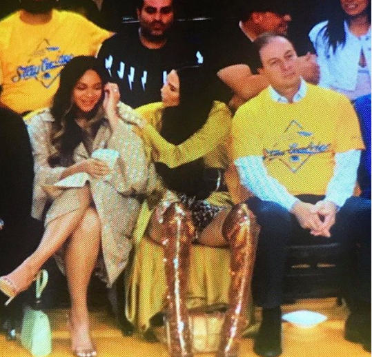 Woman leaning over Beyonce at game shares photo of her and Bey to show they are good but the Beyhive are not appeased