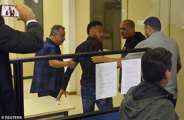 Brazil football star Neymar arrives at police station in a wheelchair for questioning after being accused of rape (Photos)