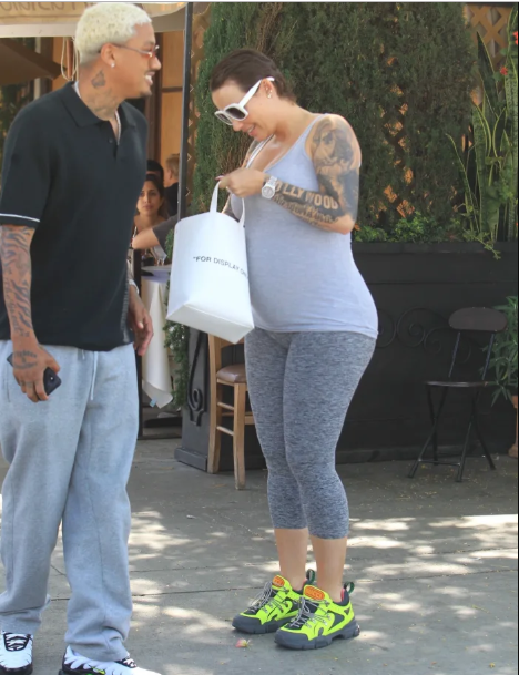 Amber Rose ditches her signature blonde look as she starts growing her hair (Photos)