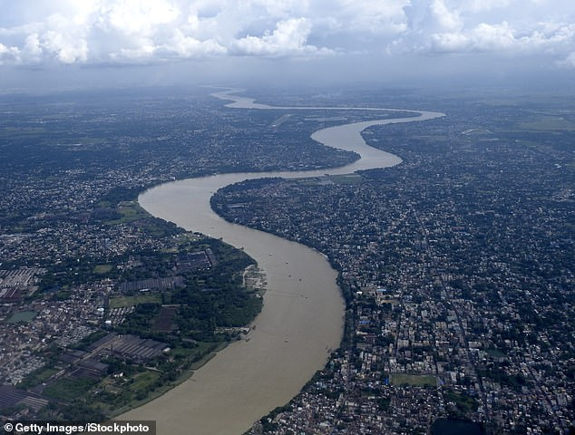 Update: Indian stuntman who was lowered into the river while tied up is feared dead as first images of the stunt emerge ?(Photos)