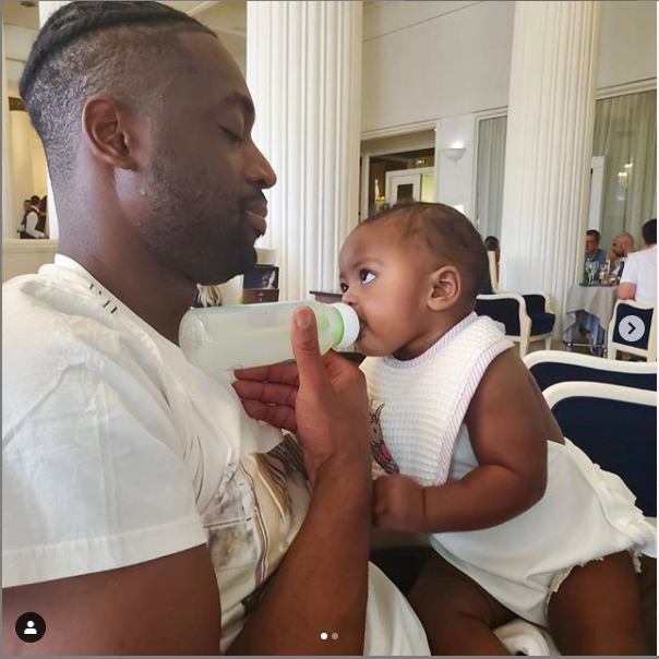 Daddy Duties! Dwyane Wade bottle feeds his daughter, Kaavia? (Photos)