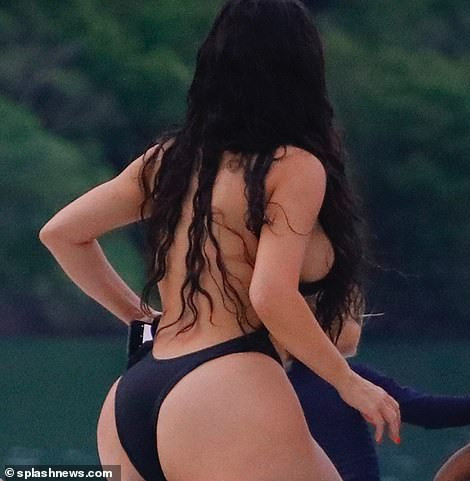 Kim Kardashian flaunts her famous backside in skimpy black swimsuit during boat day in Costa Rica (Photos)