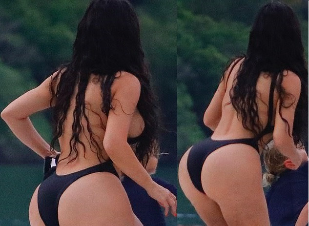 Kim Kardashian flaunts her famous backside in skimpy black swimsuit during boat day in Costa Rica (Photos)