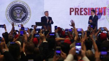 Donald Trump is recorded by the crowd speaking at the Teen Action Summit in Washington, DC