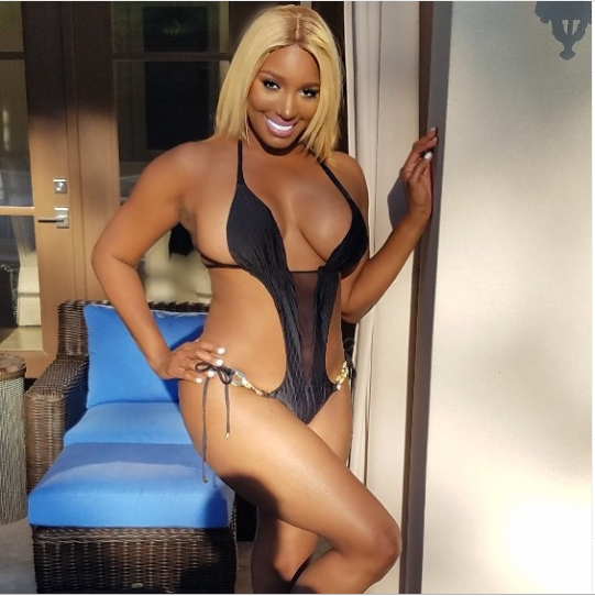 Reality star NeNe Leakes shows off her banging body in tiny black bathing suit (Photos)