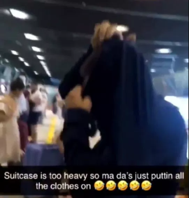 Father puts on 15 tops to avoid paying over weight baggage charge (video)