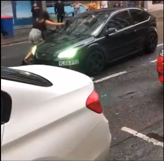 Dramatic roadrage incident ends in driver knocking down passerby (video)