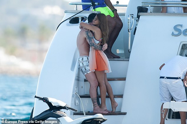 Lionel Messi and his stunning wife Antonella Roccuzzo pack on the PDA aboard a luxury yacht in Ibiza (Photos)