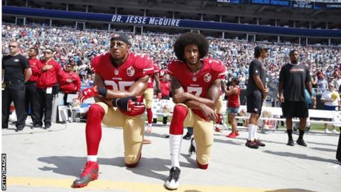 Eric Reid and Colin Kaepernick kneel for the national anthem