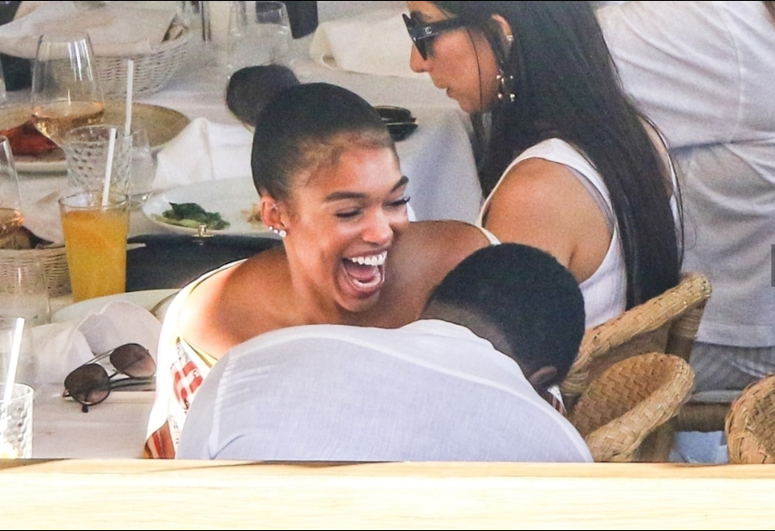 Diddy, 49, and rumored girlfriend Lori Harvey, 22, pack on the PDA during outing with her family. (Photos)