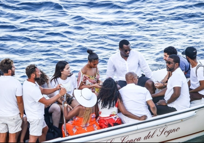 Diddy, 49, and rumored girlfriend Lori Harvey, 22, pack on the PDA during outing with her family. (Photos)