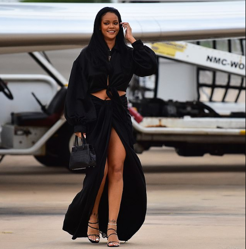 Rihanna flaunts her hot legs in sexy thigh-high split skirt as she touches down in Barbados (Photos)