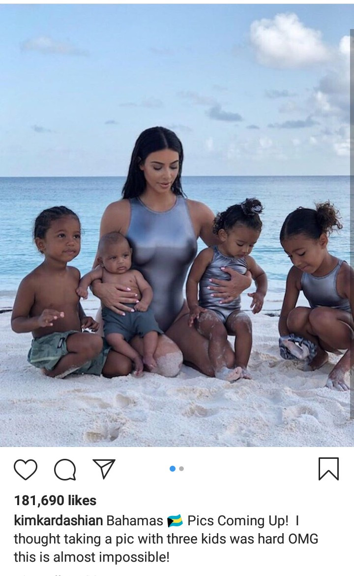 Kim Kardashian shares adorable photos of her and her kids on vacation as she talks about how hard it is to get them to pose for photos