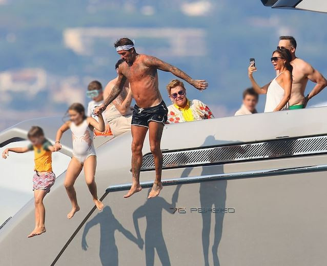 Photos: David and Victoria Beckham go on yacht ride with Elton John