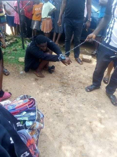 Photos: Woman chained and paraded for allegedly stealing from an orphanage in Anambra