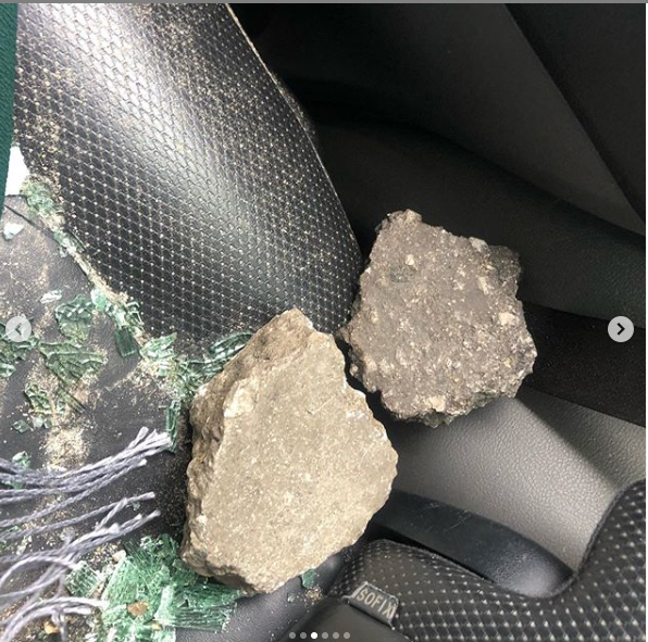 Xenophobia: Lady shares photos of injuries she sustained and damages done to her car after being attacked in Lagos protest 