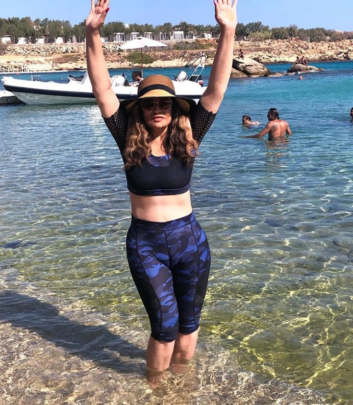 Tina Lawson shows off her taut midriff in her "over 60 swimsuit"