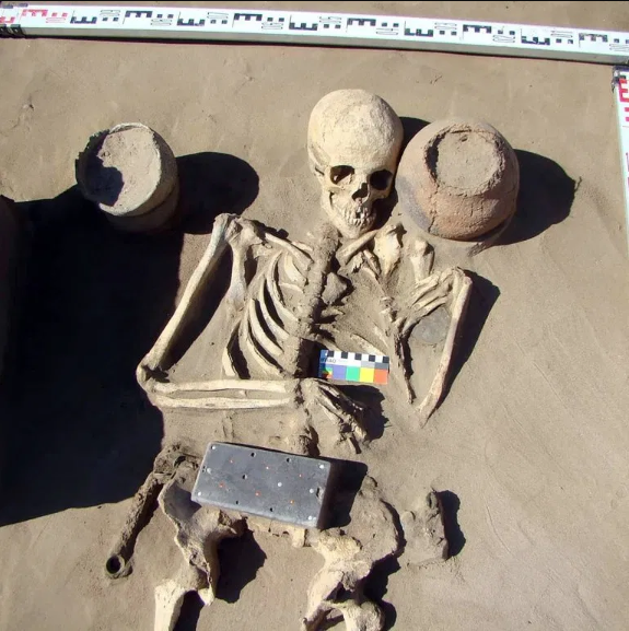 Archaeologists discover ancient skeleton buried with