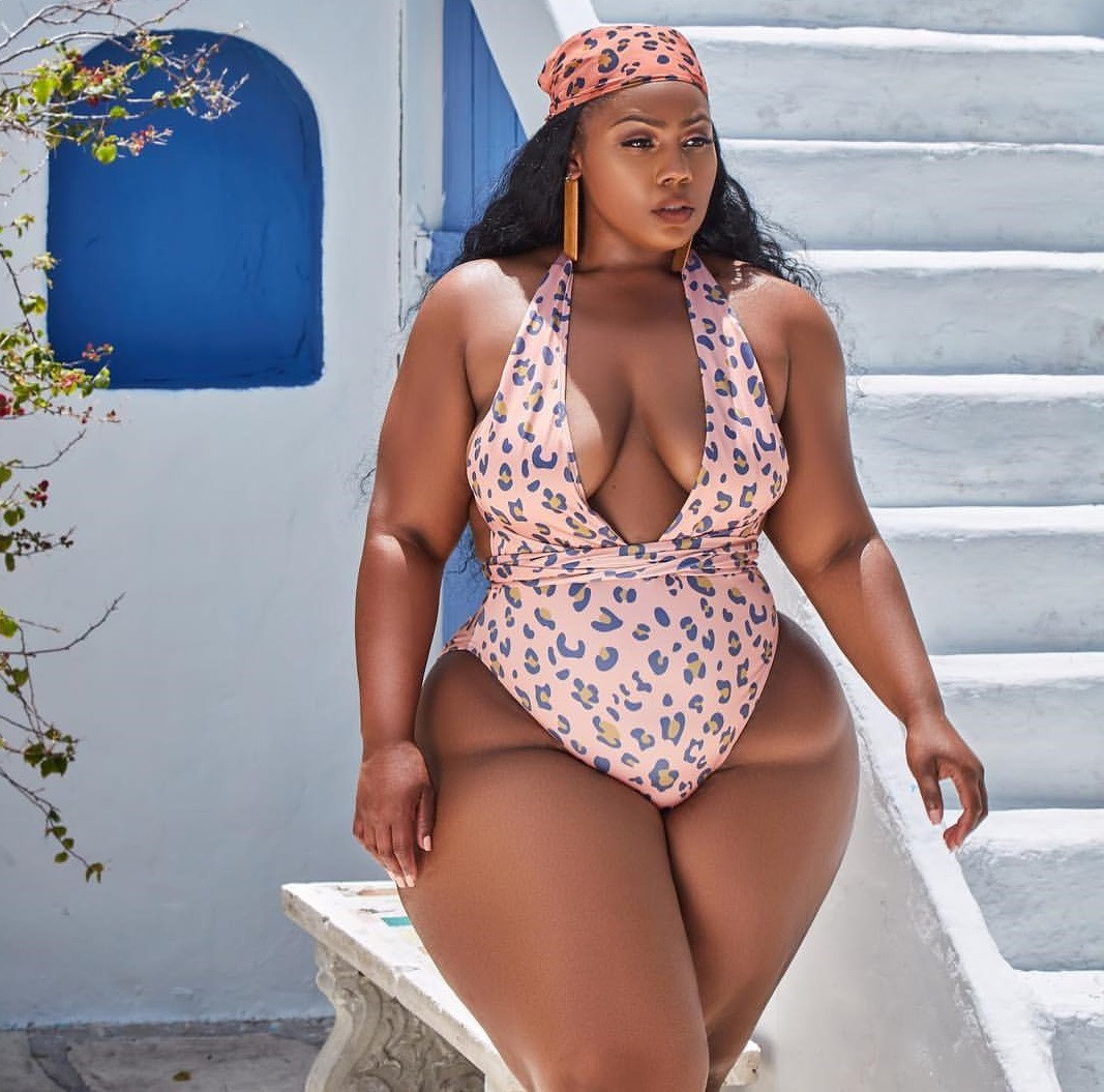 Plus sized South African lady flaunts her curves in a swimsuit