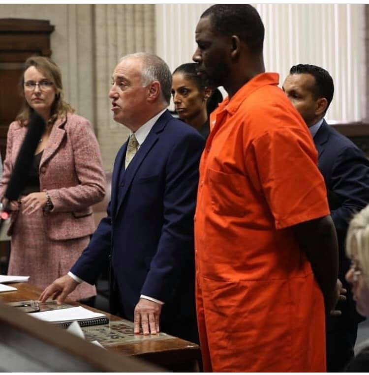 Photos and video of R.Kelly handcuffed and in prison outfit as he appears in court