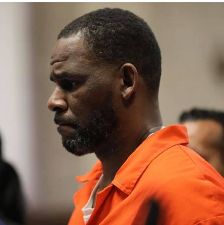 Photos and video of R.Kelly handcuffed and in prison outfit as he appears in court