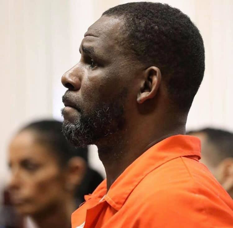 Photos and video of R.Kelly handcuffed and in prison outfit as he appears in court