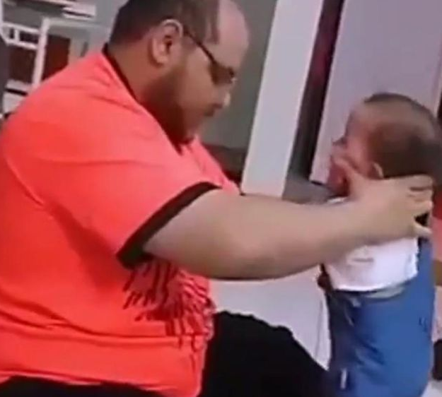 Man filmed slapping and throwing baby on the floor to force the child to walk has been arrested (video)