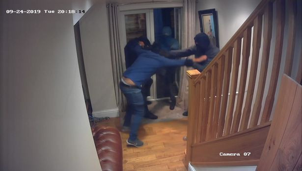 Courageous man fights off four masked robbers who broke into his home (photos/video)