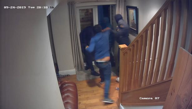 Courageous man fights off four masked robbers who broke into his home (photos/video)