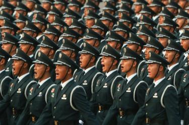 Soldiers of the People's Liberation Army shout during the rehearsal of the parade on the morning of 1 October 2019, in Tiananmen Square, Beijing.