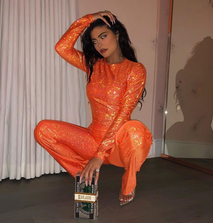 Kylie Jenner is seemingly unbothered as she poses in orange jumpsuit amidst reports she reunited with ex Tyga after split with Travis Scott