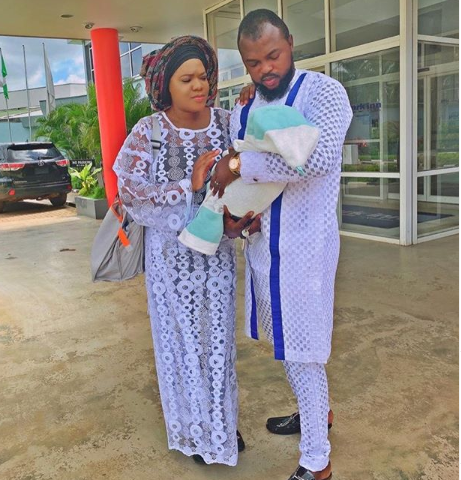 Photos of Toyin Abraham and Kolawole Ajeyemi in church with their child