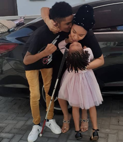 Anna Ebiere receives a kiss from Flavour