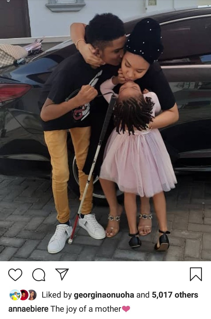 Anna Ebiere receives a kiss from Flavour