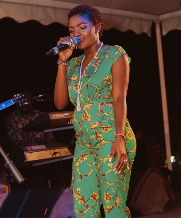 Simi seen performing with a visible bump