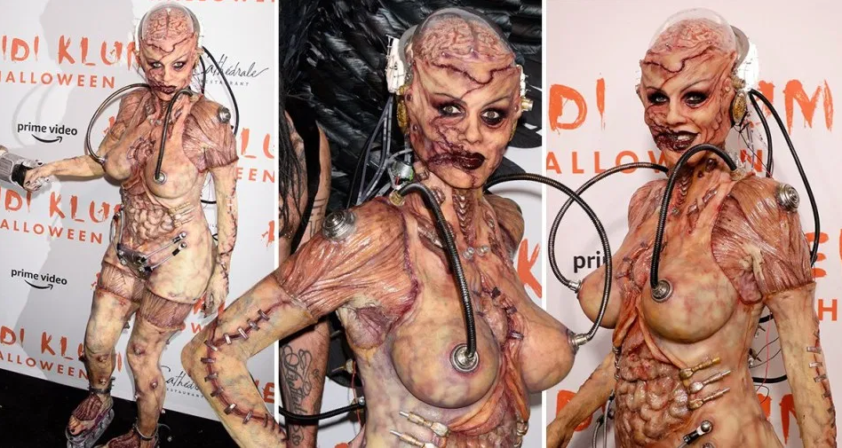 Heidi Klum beats her previous record as she reveals her gory Halloween costume after 13 hours of prosthetics   