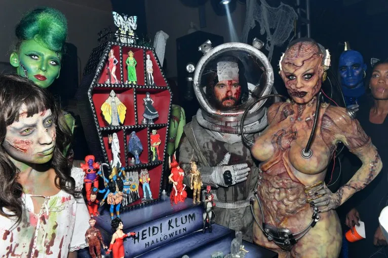 Heidi Klum beats her previous record as she reveals her gory Halloween costume after 13 hours of prosthetics   