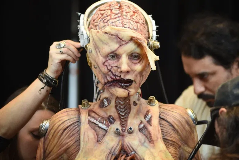 Heidi Klum beats her previous record as she reveals her gory Halloween costume after 13 hours of prosthetics   