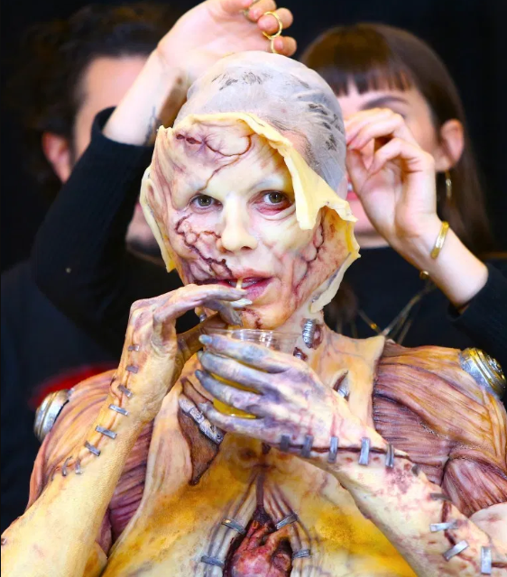 Heidi Klum beats her previous record as she reveals her gory Halloween costume after 13 hours of prosthetics   