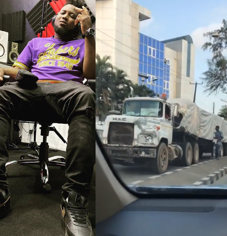 Chinko Ekun shares video of trailer without brake plying a busy road while a boy uses a huge stone to wedge the tyre at intervals