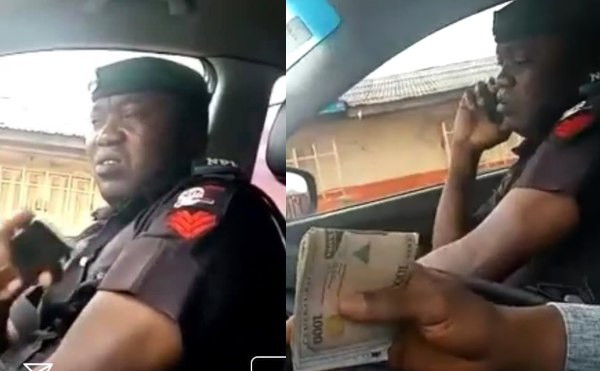 Bribe-taking policeman spotted lying to his colleagues about the amount he collected from a motorist (video)