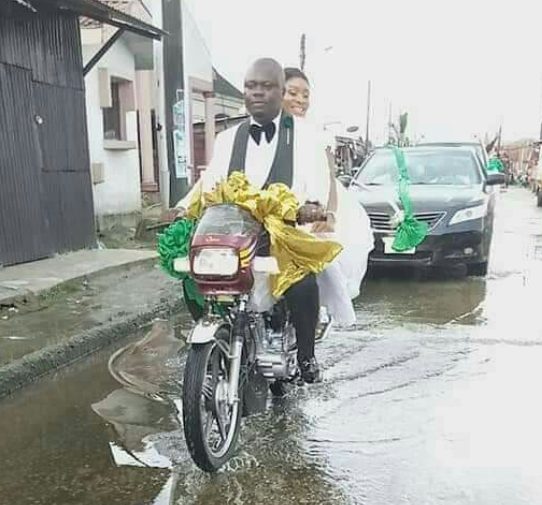 Nigerian couple ride home on a bike after their wedding in Rivers State (Photos)