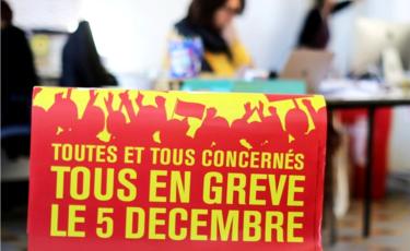 A poster reads: "All on strike on 5 December" - at the Bourse du Travail during preparations for the national strike against the French government's pension reform plans, in Nice