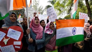 Demonstrators during a protest against the Citizenship Amendment Act (CAA), near Jamia Millia Islamia on December 15, 2019 in New Delhi, India